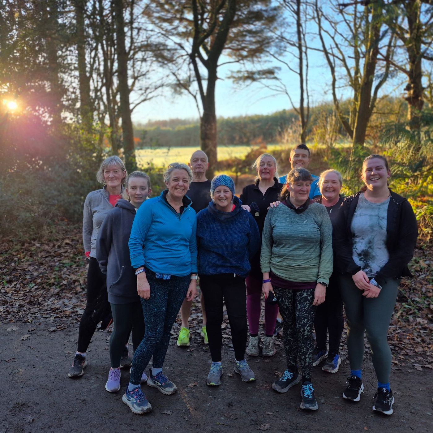 Group of runners in autumn woodland